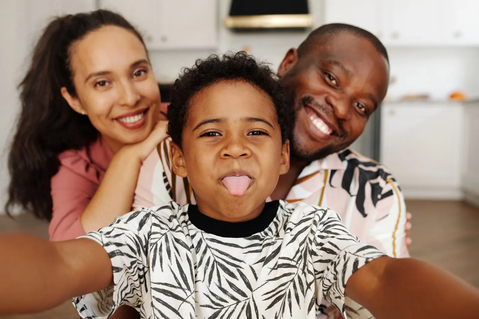 A cheerful family taking a selfie together at home.